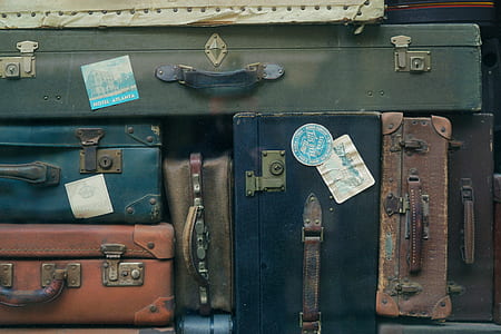 piled assorted-color suitcase thumbnail