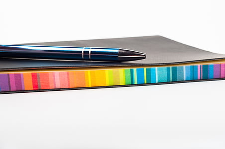 black ball-point pen and notebook thumbnail