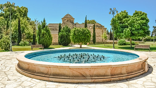 round white concrete fountain at daytime photo thumbnail