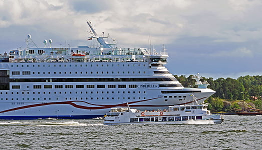 cruise ship sailing near island thumbnail