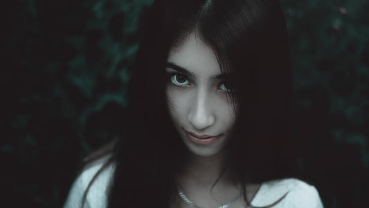 woman wearing white shirt and silver-colored necklace thumbnail