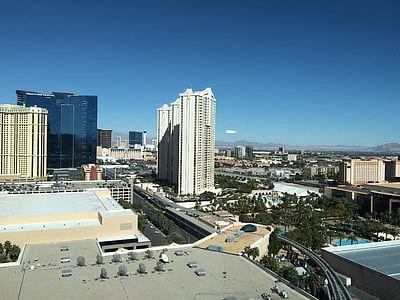 aerial photo of white concrete building under blue sky at daytime thumbnail