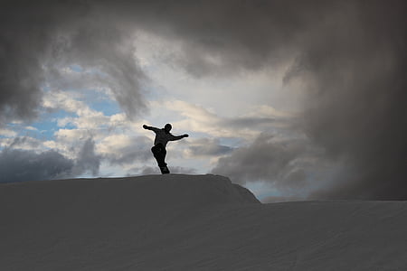 silhouette of persona on white sand at daytime thumbnail