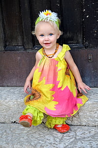 girl wearing yellow and pink sunflower print clothes thumbnail