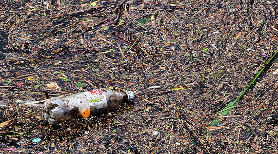 plastic bottle on muddy ground thumbnail