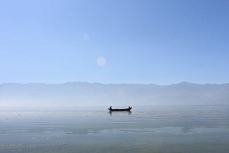 black boat in body of fwater thumbnail