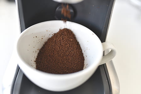 white ceramic cup with black coffee thumbnail