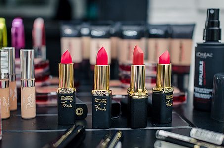 selective focus photography of four red lipsticks thumbnail