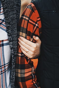 person holding arm taken at daytime thumbnail