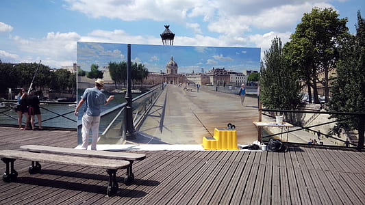 man painting bridge on wooden dock thumbnail
