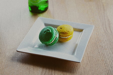 green and yellow macaroons on square plate thumbnail