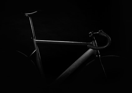 gray triathlon bicycle in dark room thumbnail