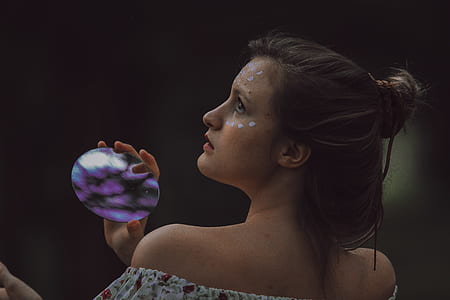 photo of woman holding purple plastic case thumbnail