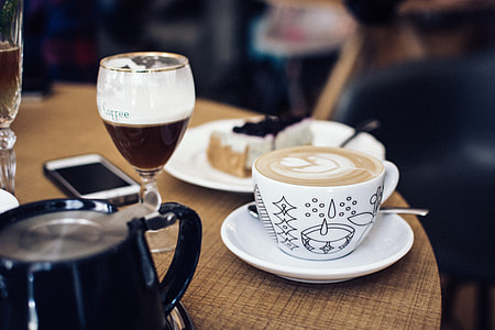 Cappuccino with latté art on a table thumbnail