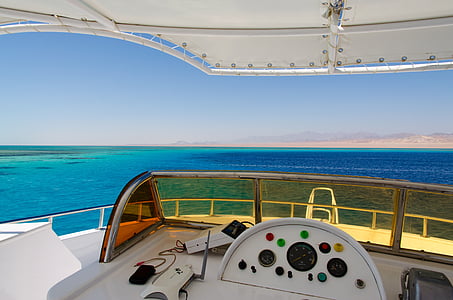 white yacht on body of water thumbnail