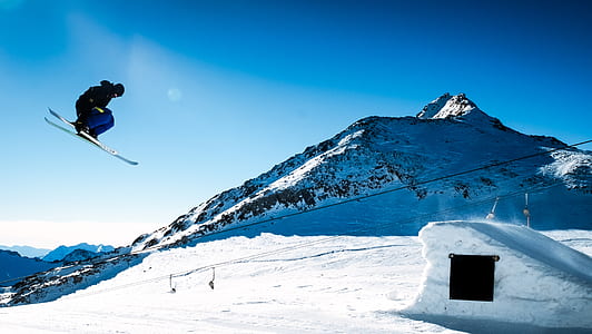 person ice skiing near mountain on daytime thumbnail