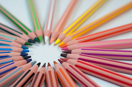 assorted-color of color pencil formed as sun rays illustration photo thumbnail