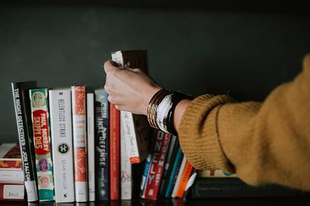person holding book thumbnail