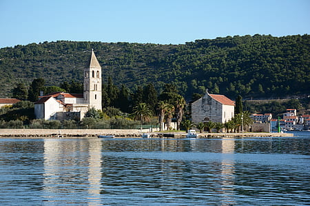 church near body of water thumbnail