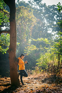 woman leaning on tree thumbnail