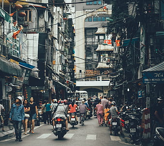 people walking on street near white building thumbnail