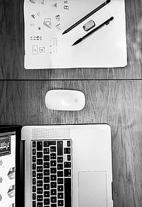Apple Magic Mouse beside MacBook Pro thumbnail