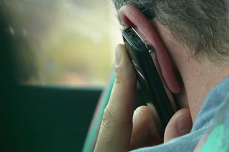 person holding phone thumbnail