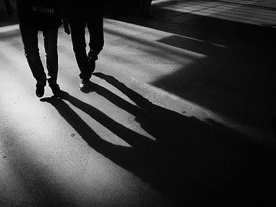 shadow of men walking thumbnail