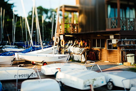 selective photography of white motorboat thumbnail