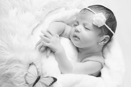 grayscale photo of baby sleeping thumbnail