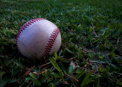 white and red baseball on ground thumbnail
