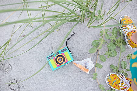 Multicolored Digital Camera With Pair Brown Shoes thumbnail