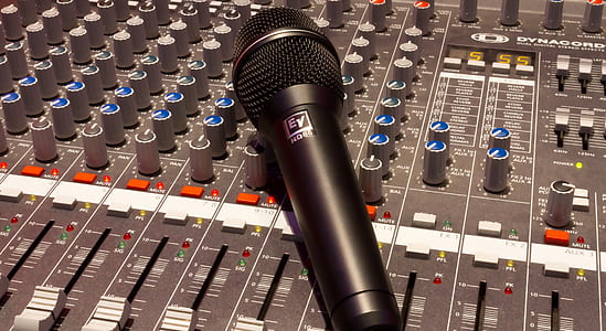 black wireless microphone on gray audio mixer thumbnail