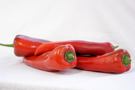 selective focus photography of four red jalapenos thumbnail