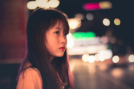 Woman Wearing Beige Tops and Bokeh Light thumbnail