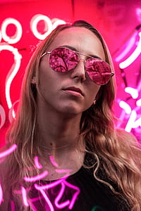 woman wearing black top with lighted background thumbnail