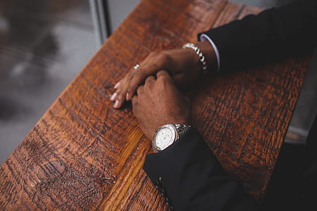 person wearing silver-colored watch and bracelet thumbnail