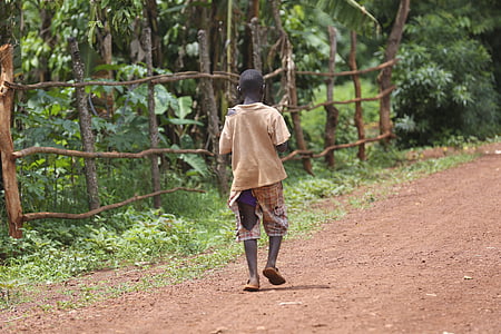 kid in brown top in middle of forest during daytime thumbnail