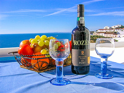Rozes wine bottle near drinking glass thumbnail