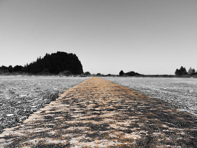 selective focus photography of brown road towards mountains thumbnail