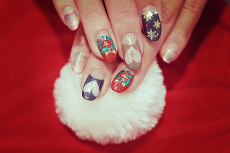 closeup view of human fingers with nail polish artwork thumbnail
