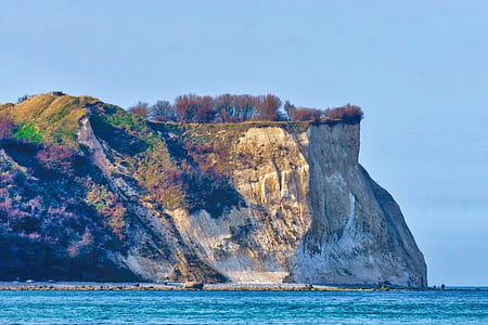 landscape photography of cliff near ocean thumbnail
