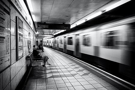A woman waits on the platform as the train arrives on the London Underground thumbnail