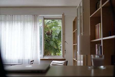 white curtain near wooden cabinet inside room thumbnail