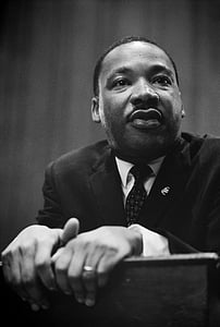 grayscale photo of man in black suit jacket thumbnail