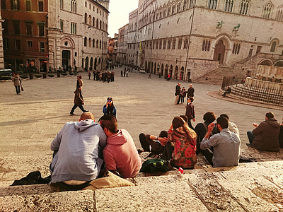 people sitting on stair near building during daytime thumbnail
