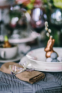 Round dinner table decorated with easter motifs thumbnail