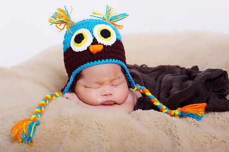 baby wearing critter cap thumbnail