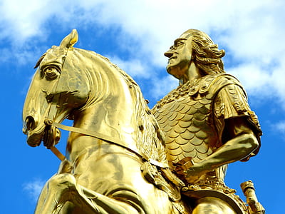 gold-colored man riding on horse statue thumbnail
