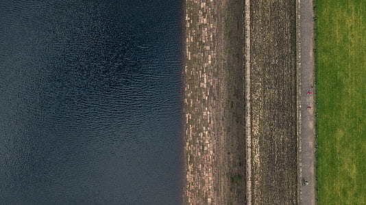 aerial view of road near body of water thumbnail